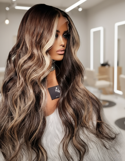 Side view of A mannequin displays NuHaire's Sun Kissed Caramel Brown Balayage | 13x4 Natural Wavy. This 180% density human hair wig features balayage coloring, premium European human hair, natural wave texture, and a 13x4 transparent lace for a realistic hairline.