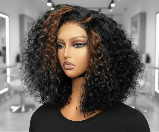 Mannequin head featuring NuHaire's Caramel Blonde Highlight Curly Bob Wig, showcasing a flawless caramel blonde highlight, premium human hair quality, 13x4 HD lace front, natural hairline, and bouncy loose curl texture against a gray background.