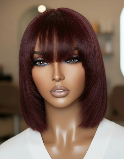 Side view of a mannequin head displaying NuHaire's Burgundy Straight Bob with Bangs, showcasing a flawless Burgundy 99j hair color, premium human hair quality, glueless installation, and silky straight texture.
