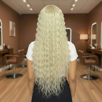 Back view of a Model wearing NuHaire #613 Blonde Loose Deep Wave Lace Front Human Hair Wig, showcasing flawless blond color, flowing loose deep waves, premium Human Hair Quality, transparent lace front, and natural hairline.