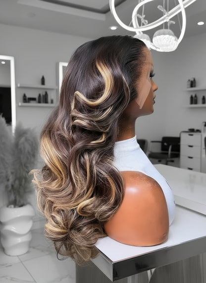 Side view of Mannequin head displaying NuHaire's Light Brown Highlight Body Wave Lace Front Wig. This wig features a dark brown hair color with a light brown highlight, a bouncy body wave texture, premium human hair, and skin-melt 13x4 transparent lace.