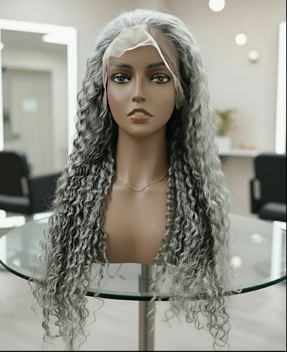 Front view of a Mannequin head displaying NuHaire's Silver Grey Deep Curly Transparent Lace Front Human Hair Wig, featuring a natural silver grey hair color, premium quality human hair, a bouncy deep curly texture, and a 13x6 transparent lace front.