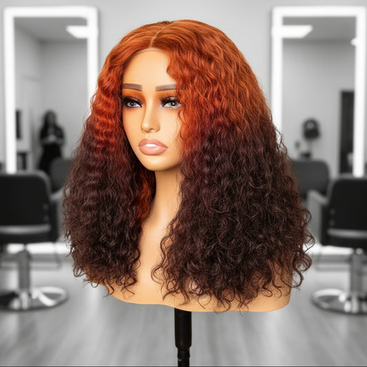 Different angle of A mannequin head showcasing NuHaire's 13x4 T-Part Ginger Ombre 4/350 Curly Wave Lace Front Human Hair Wig. The wig features a flawless ombre transition from ginger to brown, made from premium human hair. It includes a transparent lace front, a natural hairline, and beautiful, flowing curly waves.