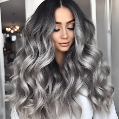 A model wearing NuHaire's High Density Grey Ombre Human Hair Wig, showcasing a flawless silver grey ombre color transition, premium human hair quality, 13x4 lace front, natural hairline, and flowing loose wave texture.