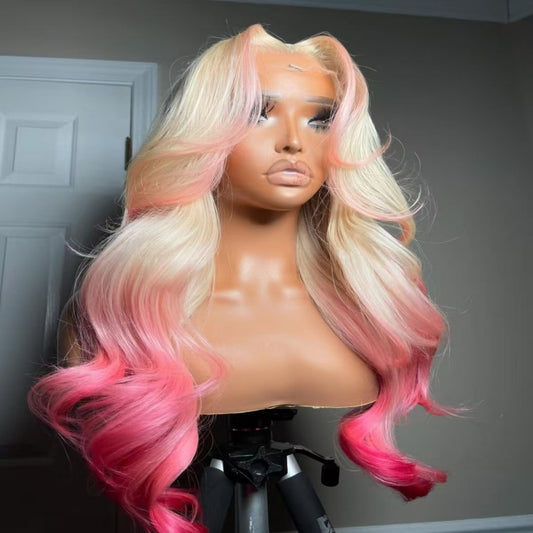 Mannequin head featuring NuHaire's 5x5 pink peekaboo highlights on a 613 blonde body wave human hair wig, showcasing a flawless color transformation, premium human hair quality, lace closure hairline, and bouncy body waves against a gray background.