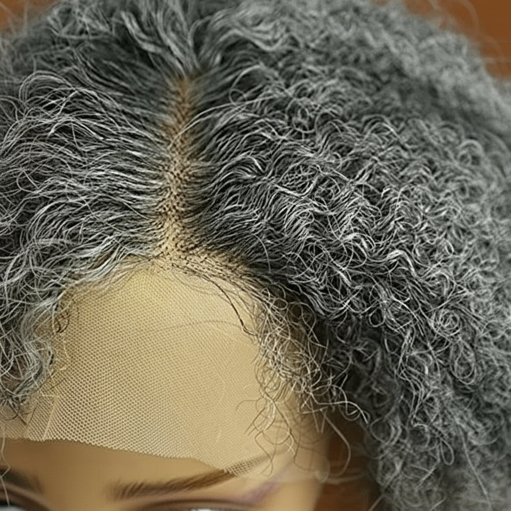 Closer view of mannequin head showcasing NuHaire's Salt & Pepper Kinky Curly Bob | 13x4x1 Transparent Lace Human Hair Wig, featuring a natural black and silver grey hair color, premium human hair, bouncy kinky curly texture, and a 13x4 Transparent Lace Front.