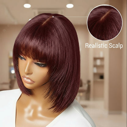 A mannequin head showcases NuHaire's Burgundy Straight Bob with Bangs. This wig features a flawless Burgundy 99j hair color, premium human hair quality, glueless installation, a layered cut, a realistic scalp, and a silky straight texture.