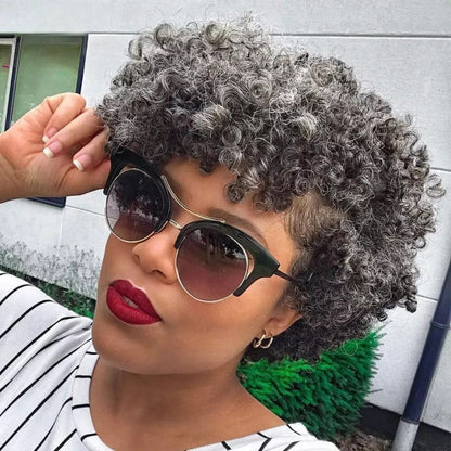 Salt and pepper kinky curly bob wig with bangs showcasing sophisticated silver gray color"