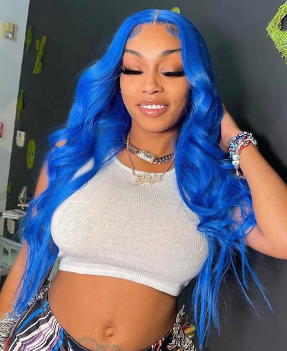 A person wearing a NuHaire sky blue human hair wig with a 13x4 transparent lace front, pre-plucked hairline, cascading waves, and premium quality