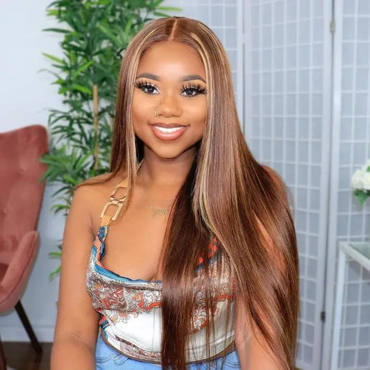 A model wearing NuHaire's Honey Blonde Highlight Straight wig showcases flawless honey blonde highlights, premium human hair quality, 6x4 glueless construction, even strand length, and a naturally straight texture against a neutral background.