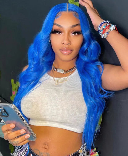 A person wearing a NuHaire sky blue human hair wig with a 13x4 transparent lace front, pre-plucked hairline, wearing a white top.